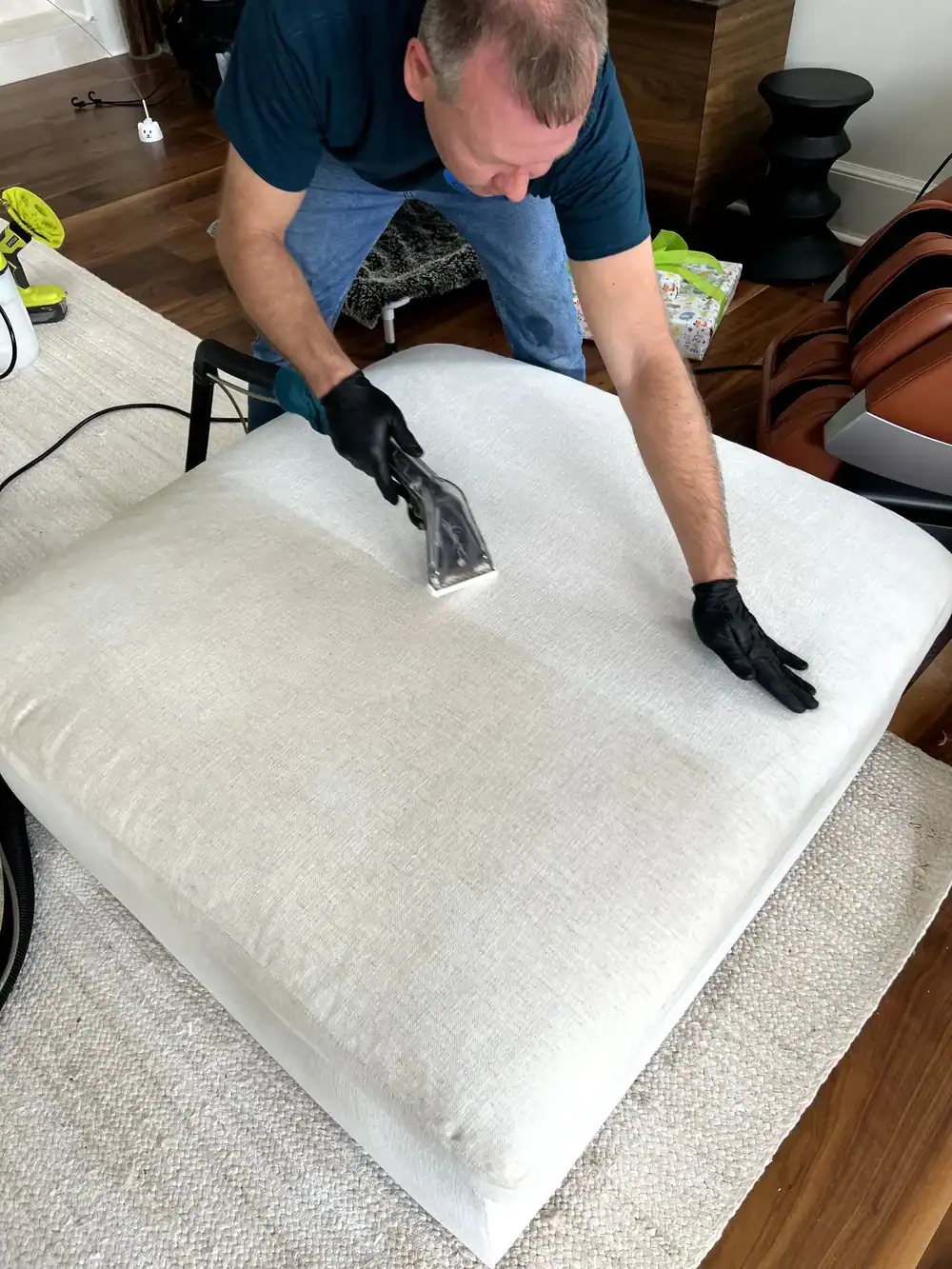 Hot water extraction upholstery cleaning process removing dirt and solution in Jacksonville, FL